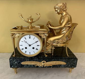 FRENCH EMPIRE BRONZE & GILDED MANTEL CLOCK: depicting the Reader After Reiche by Claude Galle and Grand Girard, the silvered dial with gilded Roman numerals cradled by a classical figure, raised on a stepped green marble base. 35 cm. high; Appr
