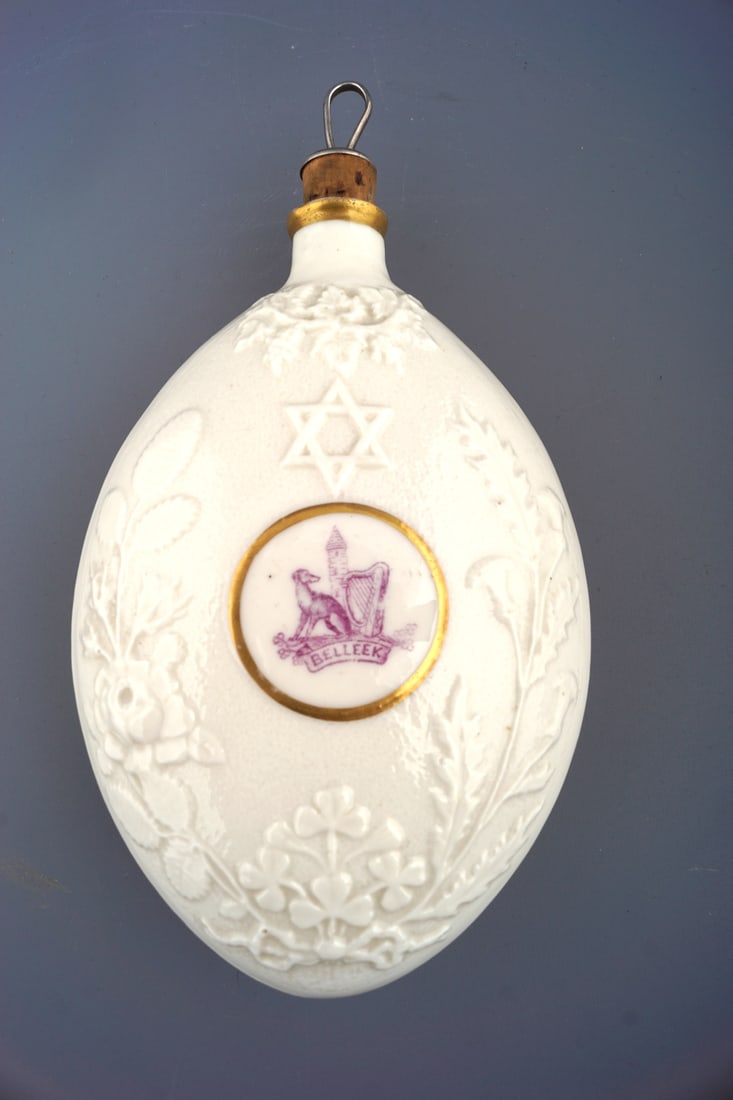 1ST PERIOD BELLEEK JEWISH CIRCUMCISION FLASK: of ovoid shape with raised moulded decoration. 18 cm. high; 10 cm. wide Approximate Time: 11:58 Lot No: 162