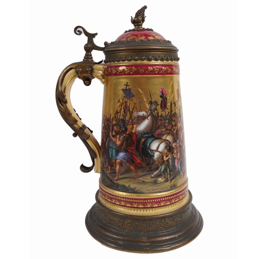 AN AUSTRIAN GILT AND RUBY GROUND PORCELAIN STEIN: Vienna c.1880, the broad reserve hand painted with 'The Triumph of Constantine' and signed 'Joeger Pinxt', applied with leaf cast scroll handle, raised thumb piece and domed cover, on an outset gilt m