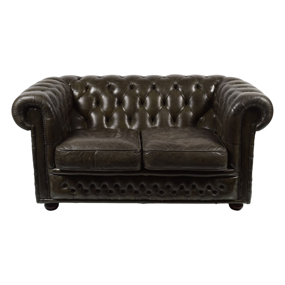 PAIR OF HIDE UPHOLSTERED CHESTERFIELD SETTEES: each with a deep-buttoned roll back and seat. 150 cm. wide; Approximate Time: 15:34 Lot Number: 880