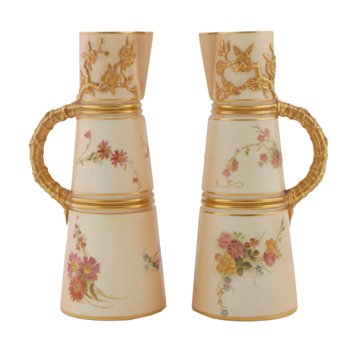 Two Royal Worcester parcel gilt and painted jugs: Two Royal Worcester parcel gilt and painted jugs 20 cm. high