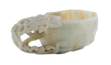 Qing period pale celadon jade cup: Qing period pale celadon jade cup carved with lingzhi fungi, the jade stone with milky white and russet inclusions, Provenance: Private Jade Collection, County Offaly 11.5 cm high