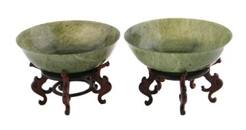 Pair Chinese late nineteenth /early twentieth-century s: Pair Chinese late nineteenth /early twentieth-century soapstone spinach coloured bowls, Each raised on a hardwood stand 12 cm. diameter