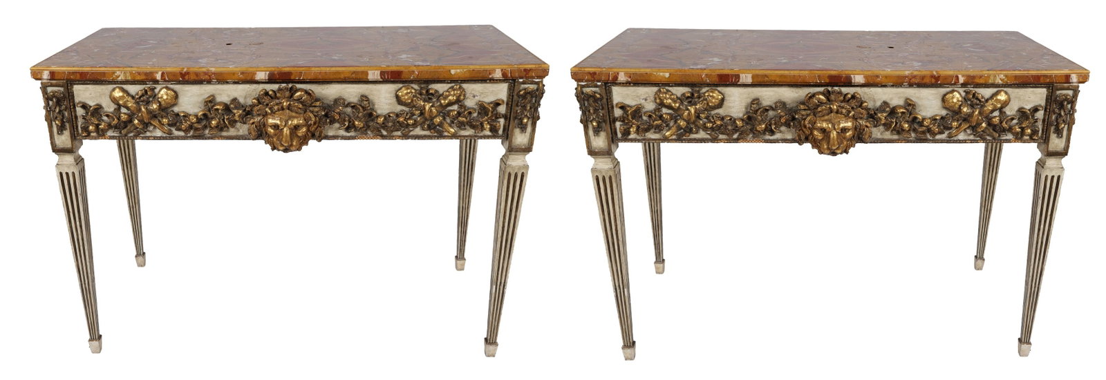 PAIR OF 19TH-CENTURY PAINTED CONSOLE TABLES: PAINTED & PARCEL GILT, An important pair of console tables, each with marble top above a frieze centred by a carved lion mask with scrolling foliate ornament, raised on fluted supports. FURNITURE
