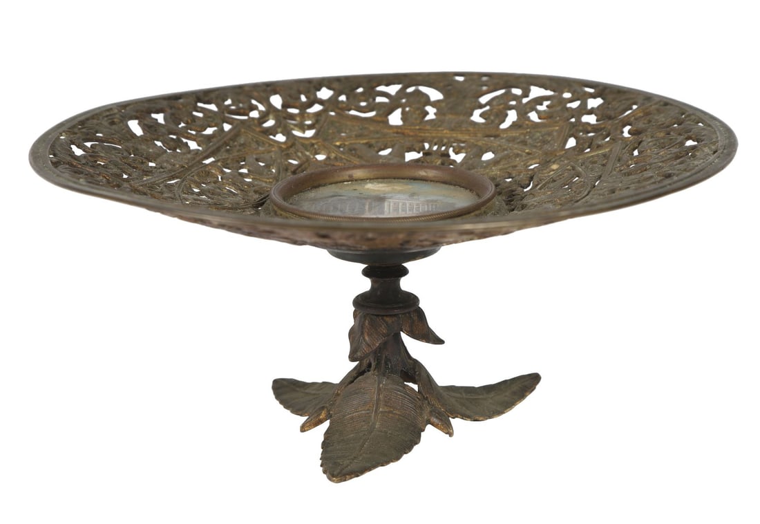 BRONZE TAZZA WITH MICROMOSAIC PANEL: The circular pierced dish centred with a micro mosaic panel depicting The Royal Exchange, raised on a spreading foot. CERAMICS