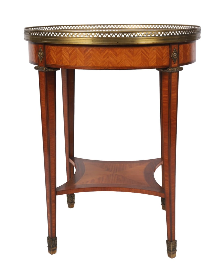 FRENCH KINGWOOD & MARBLE-TOPPED OCCASIONAL TABLE: EARLY 20TH - CENTURY, The circular marble top within a pierced brass gallery above a frieze with parquetry decoration, raised on slender legs joined by an under-tier. FURNITURE