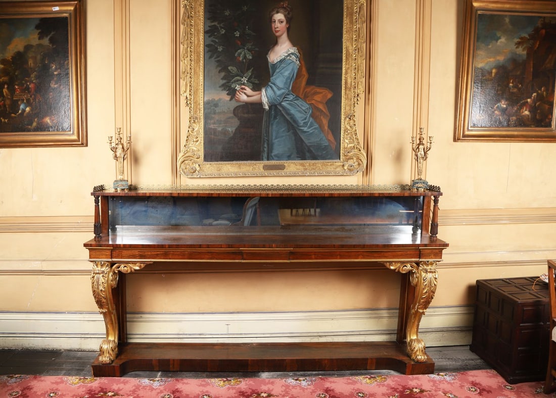 PAIR IRISH WILLIAM IV PERIOD ROSEWOOD SIDE TABLES: ROSEWOOD & GILT , Each with rectangular figured rosewood tops above friezes raised on boldly carved and gilt scroll supports, the bases united by shaped under tiers, retaining original gilt decoration