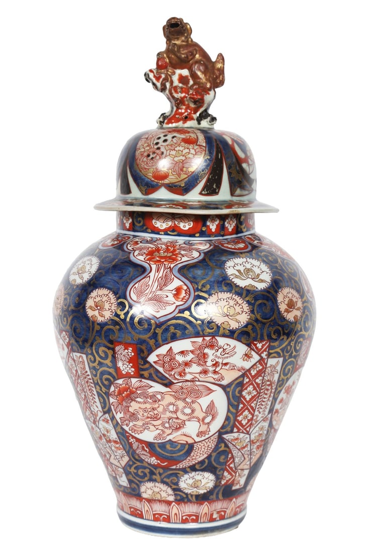 19TH-CENTURY JAPANESE IMARI VASE AND COVER: Of baluster form, decorated in underglaze blue, iron-red and gilt with panels of flowers and foliage. JAPANESE