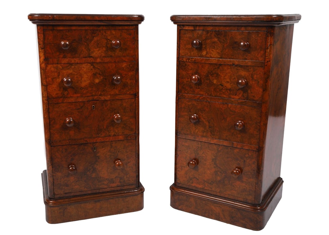 PAIR OF 19TH-CENTURY WALNUT CHESTS OF DRAWERS: Each with rectangular top above four long drawers fitted with turned wooden knob handles, veneered in figured walnut and raised on plinth bases. FURNITURE