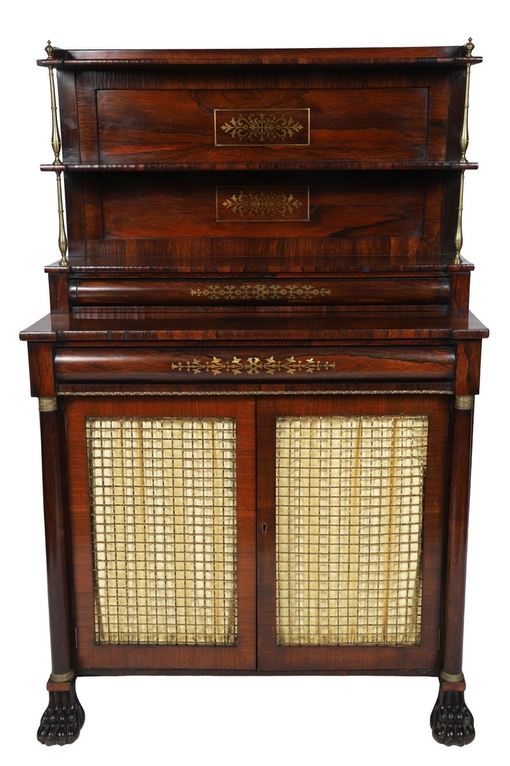 REGENCY ROSEWOOD AND BRASS-INLAID CHIFFONIER: The rectangular top above a frieze drawer, the base with a pair of grille doors enclosing shelves, flanked by column supports, raised on a plinth base, with brass line inlay throughout. FURNITURE