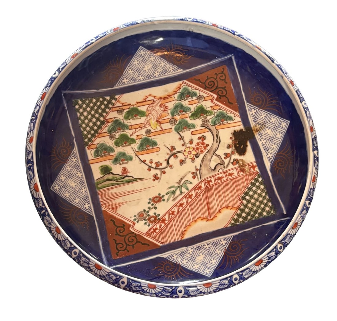 A LARGE 19TH CENTURY JAPANESE BOWL: A large 19th-century Japanese bowl, of deep circular form, decorated in Imari palette with panels of stylised flowers and geometric ornament to the interior. JAPANESE