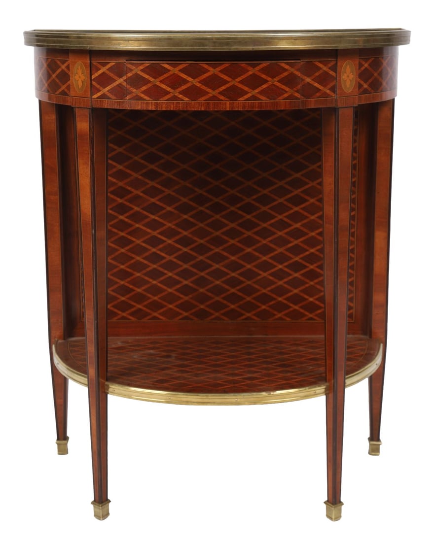 FRENCH KINGWOOD DEMI-LUNE SIDE TABLE: EARLY 20TH-CENTURY, The black marble top above a parquetry inlaid body with open shelves and gilt-metal mounts, raised on tapering supports. FURNITURE