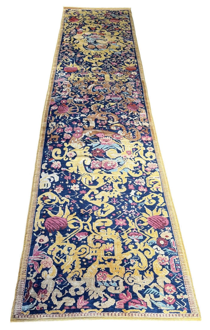 20TH - CENTURY SOUTH CAUCASIAN KARABAKH RUNNER: WITH ALL-OVER DESIGN. Of elongated form, the dark ground densely filled with scrolling vinery, stylised foliage, and floral elements in polychrome tones, set against a striking golden field pattern, e
