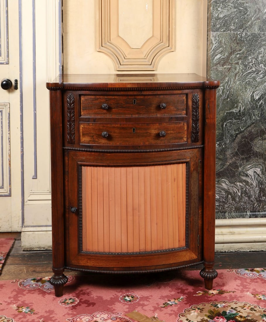 EXCEPTIONAL REGENCY ROSEWOOD SECRETAIRE CABINET: BY GILLOWS OF LANCASTER. Circa 1810. Of breakfront outline with panelled doors, the rosewood veneers of rich figuring, raised on a plinth base. Stamped. FURNITURE