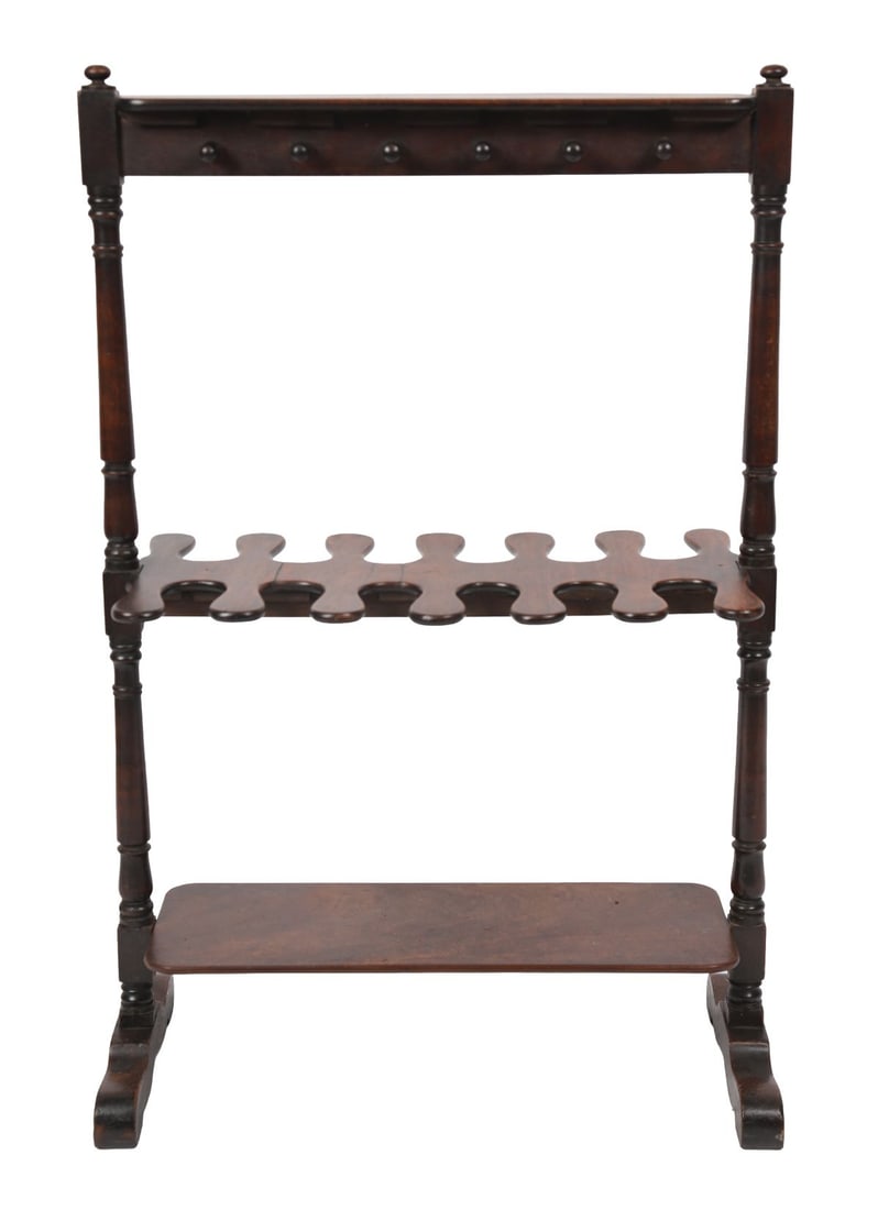 GEORGIAN MAHOGANY BOOT RACK: A mahogany boot rack with upper rail and lower shaped tier for boots. FURNITURE