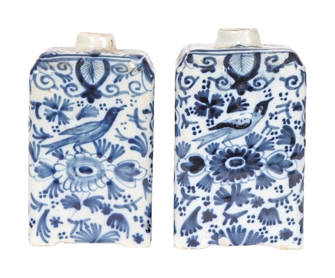 PR 18TH - CENTURY DUTCH BLUE & WHITE TEA CADDIES: A pair of 18th-century Dutch Delft blue and white tea caddies, of rectangular form with domed covers, decorated with floral and landscape scenes. PORCELAIN