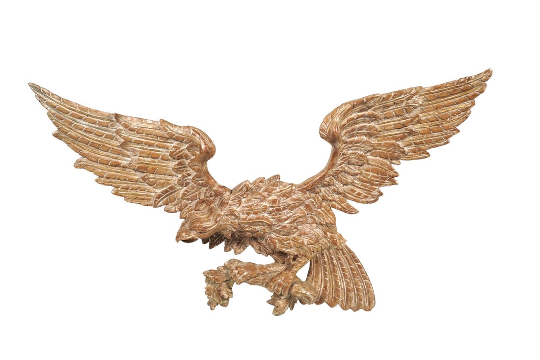MONUMENTAL AMERICAN CARVED WOOD EAGLE: circa 1830, perched on a branch with traces of original gilding. SCULPTURE