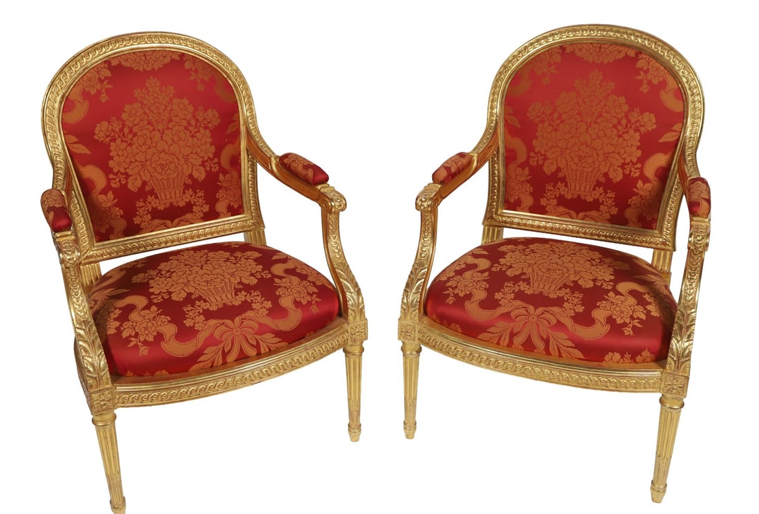 PAIR OF LOUIS XVI-STYLE CARVED GILTWOOD ARMCHAIRS: With oval backs, fluted supports and upholstered seats. FURNITURE