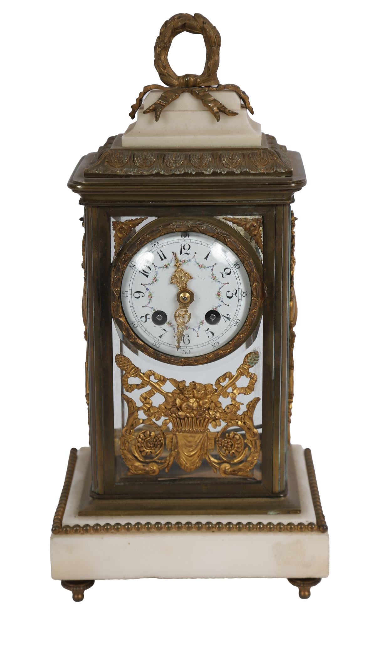 FRENCH GILT-BRONZE & GLASS 4-GLASS MANTEL CLOCK: LATE 19TH-CENTURY, Of rectangular form with bevelled glass panels, the enamel dial with Arabic numerals, the case mounted with classical trophies and raised on an onyx base with bead moulding, surmoun