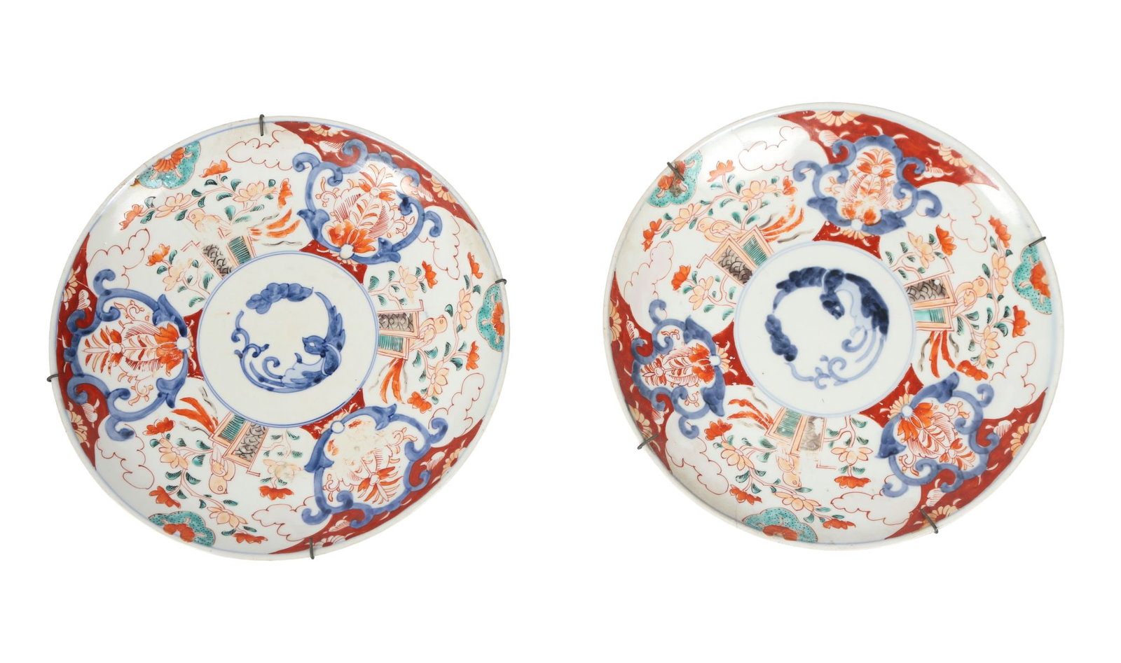 PAIR OF 19TH CENTURY JAPANESE IMARI CHARGERS: A pair of 19th-century Japanese Imari chargers, each decorated in iron-red, cobalt blue and gilt with floral panels and stylised reserves within scalloped borders. JAPANESE