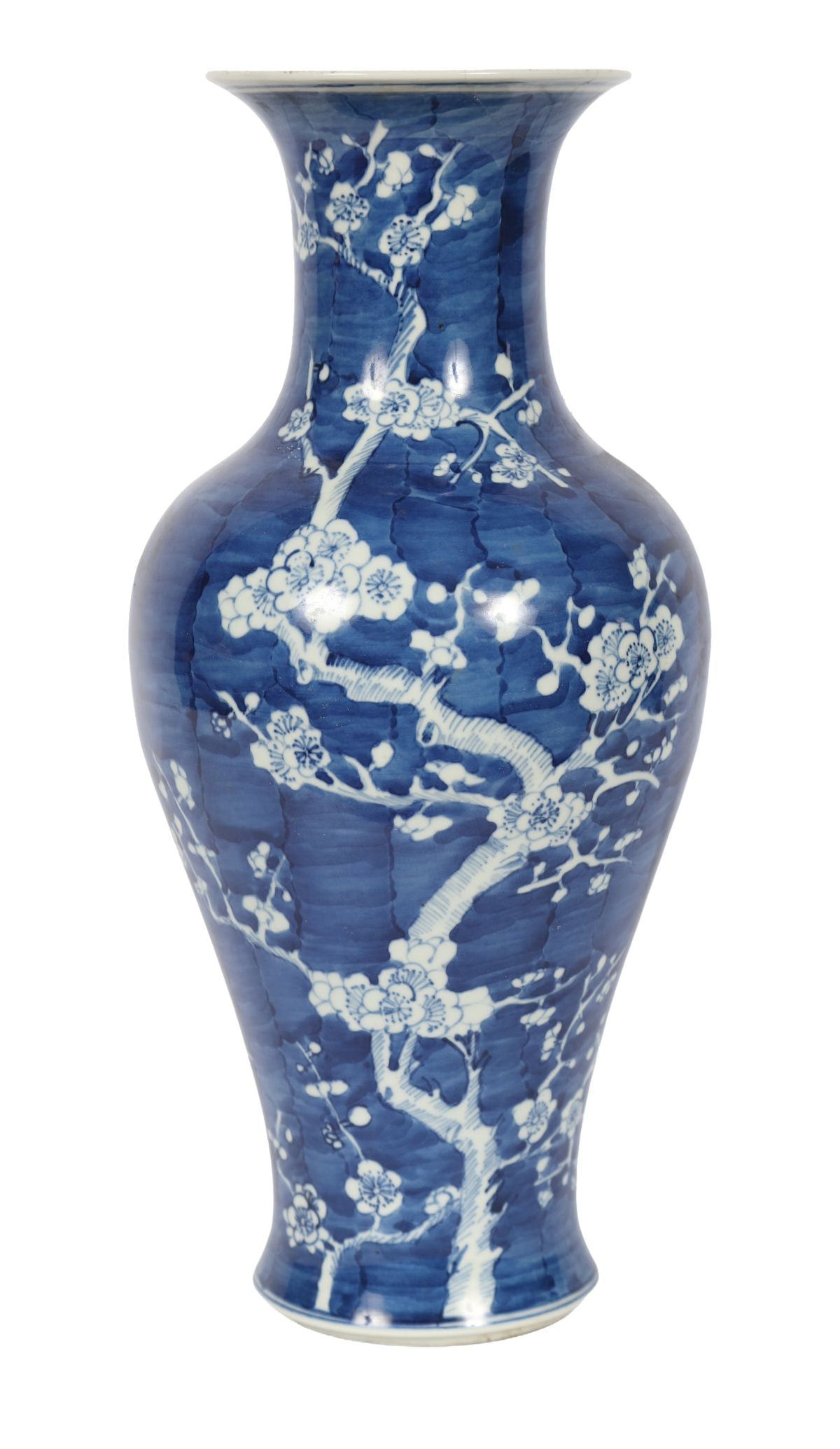CHINESE BLUE AND WHITE PORCELAIN VASE: Of baluster form with flared neck, decorated with flowering branches against a striped ground. PORCELAIN