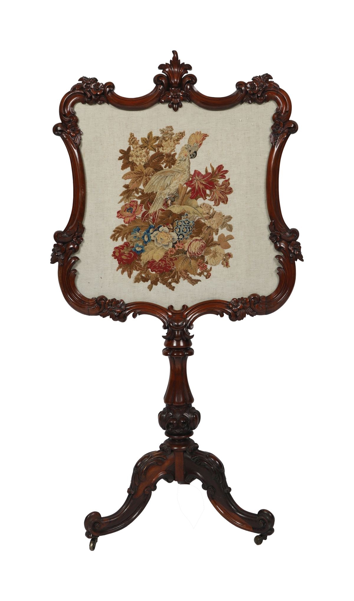 EARLY VICTORIAN MAHOGANY POLE SCREEN: The adjustable rectangular tapestry panel within a moulded mahogany frame, raised on a turned column and platform base with scrolling feet, the screen inset with a floral needlework panel. FURNITURE