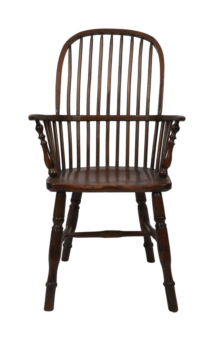 18TH - CENTURY ELM AND ASH WINDSOR ARMCHAIR: Of typical form with hoop back and spindle supports above a shaped solid seat, with outscrolled arms on turned supports, raised on turned legs. FURNITURE