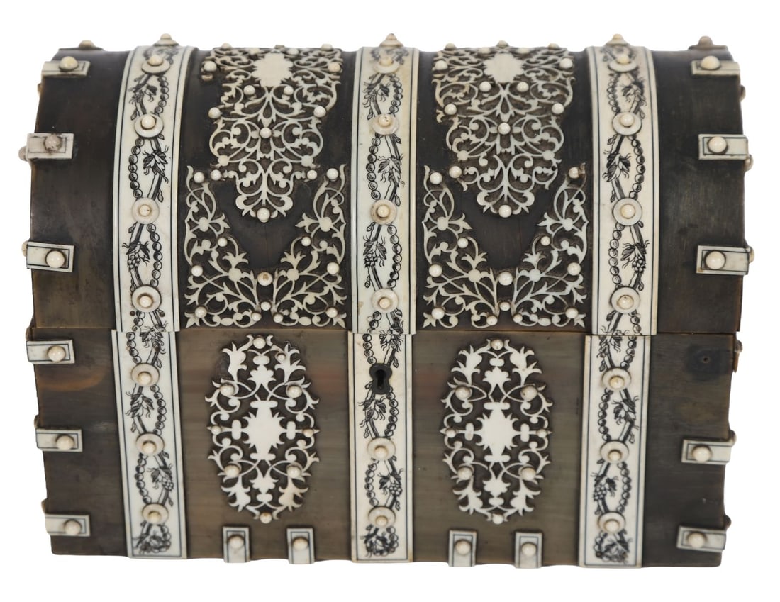 19TH-CENTURY EBONY & IVORY-MOUNTED STATIONERY BOX: Domed stationery box profusely inlaid with ivory panels and pierced foliate decoration, the hinged lid enclosing fitted interior. ANTIQUE BOXES