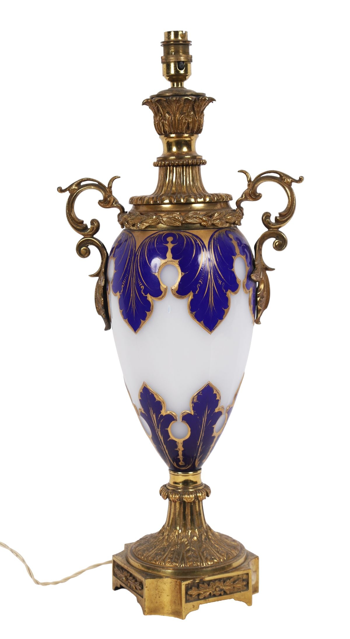 19TH-CENTURY OVERLAY GLASS AND ORMOLU TABLE LAMP: AND SHADE, Baluster-form glass vase with cobalt blue overlay and gilt decoration, mounted with gilt-bronze handles and base, later converted to a table lamp. LIGHTING