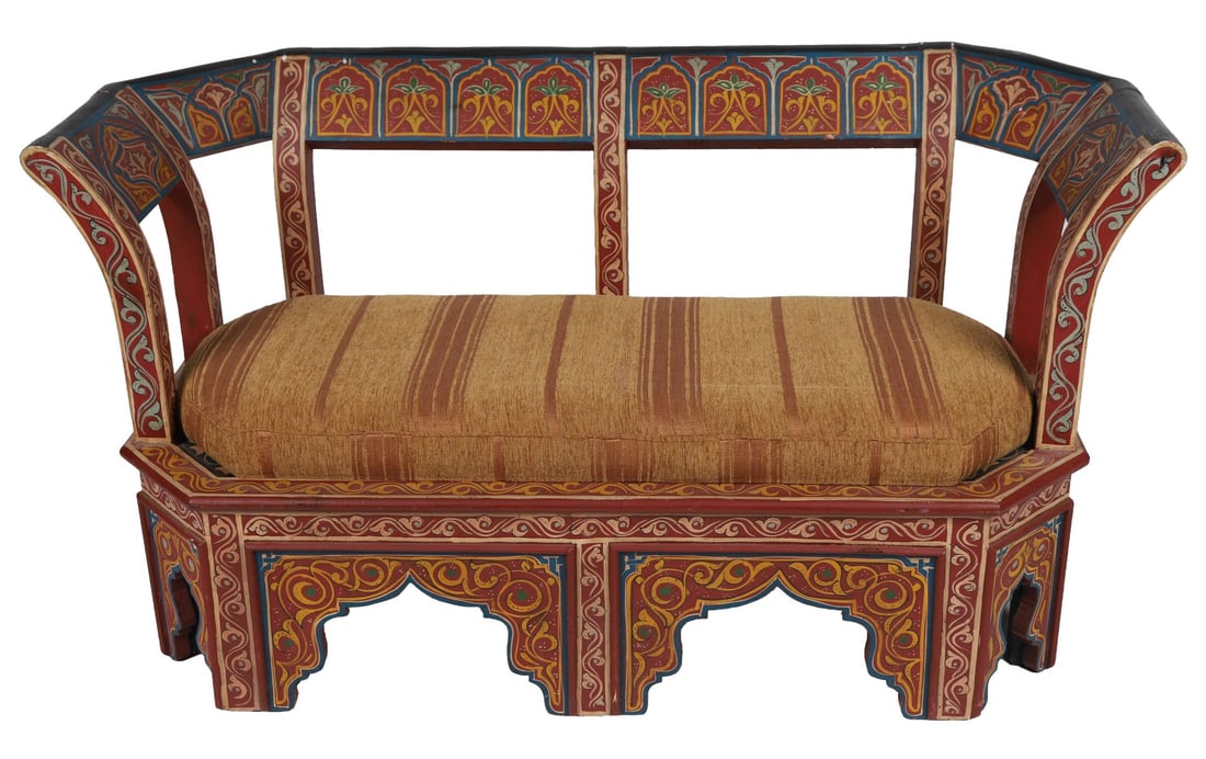 20TH - CENTURY MOROCCAN PAINTED BENCH: A 20th-century Moroccan bench, decorated with repeating geometric and stylised foliate panels, with upholstered seat, raised on shaped supports. FURNITURE