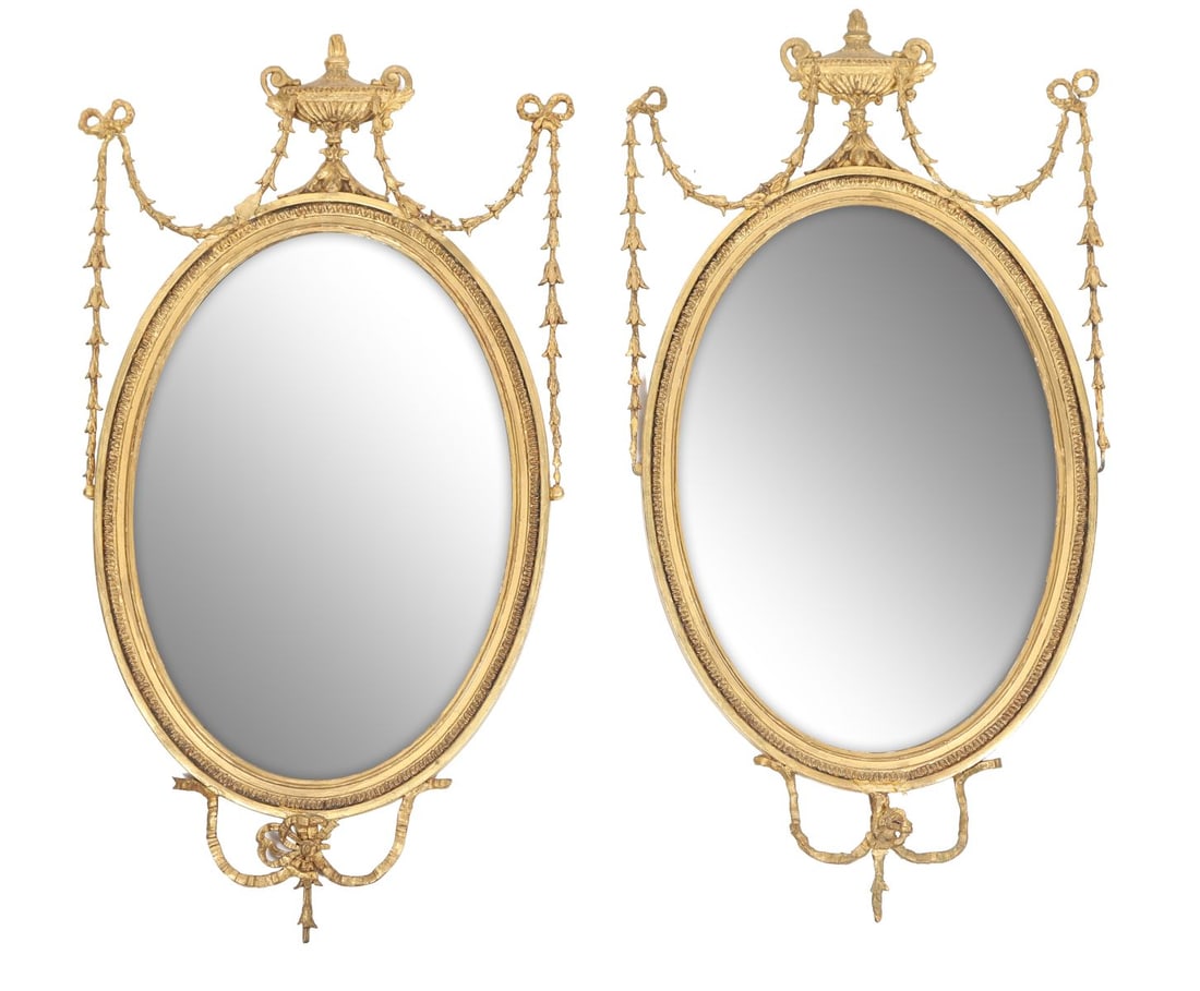PAIR OF LATE 19TH-CENTURY GILT PIER MIRRORS: Each with rectangular plate within a moulded gilt frame, surmounted by shaped cresting and with applied classical ornament. MIRRORS