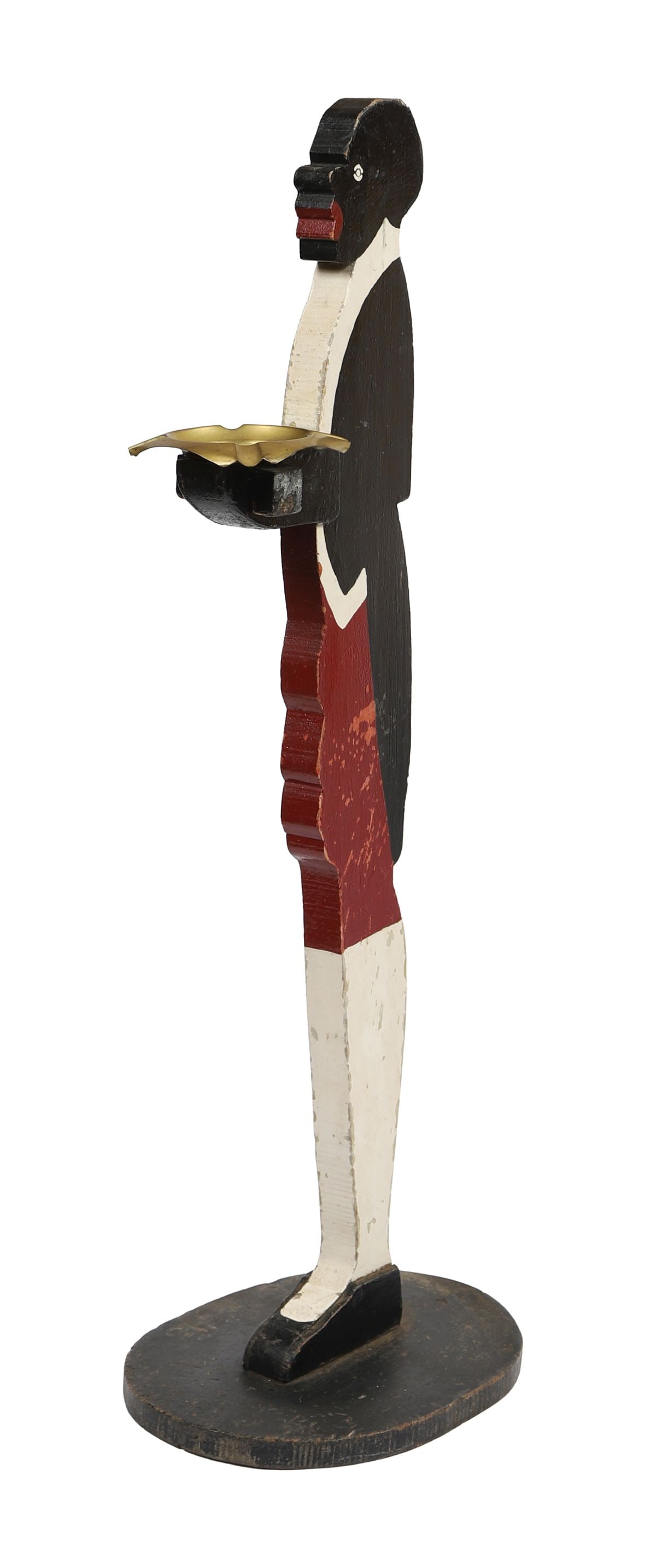 BLACKAMOOR-STYLE PAINTED WOOD FIGURAL STAND: EARLY 20TH - CENTURY, Carved and painted wooden figure modelled as a standing attendant in livery, holding a circular tray, raised on a shaped base. SCULPTURE