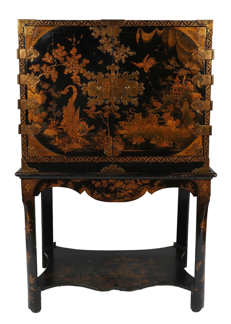 19TH - CENTURY LACQUERED CABINET ON STAND: Of rectangular form, decorated in gilt lacquer with birds and foliage on a black ground, mounted with engraved metal mounts and hinges, raised on an associated stand. FURNITURE