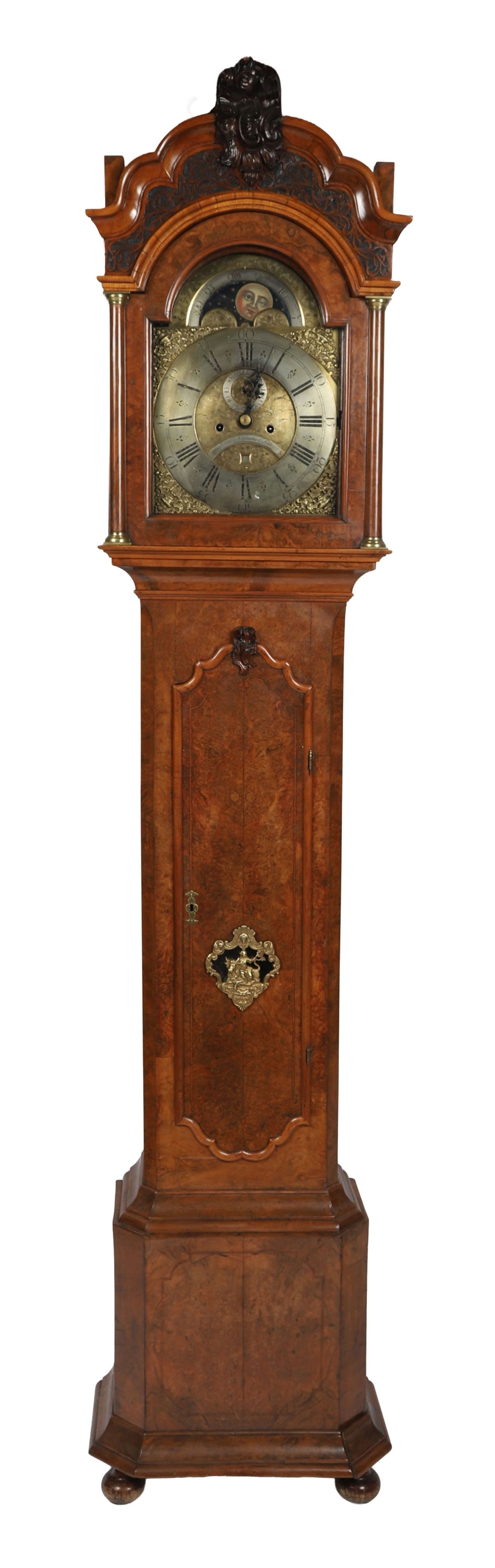 18TH - CENTURY WALNUT-CASED LONGCASE CLOCK: BY JOHN WILLIAMS, LONDON. An 18th-century walnut longcase clock, the arched hood with turned columns enclosing a brass dial with Roman numerals and subsidiary seconds dial, signed John Williams, Londo