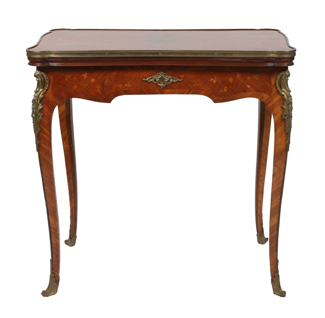 KINGWOOD &MARQUETRY-INLAID FOLD-OVER GAMES TABLE: LATE 19TH-CENTURY. The shaped rectangular top with parquetry and floral marquetry inlay, opening to reveal a baize-lined playing surface, above a frieze with gilt metal mounts, raised on cabriole legs