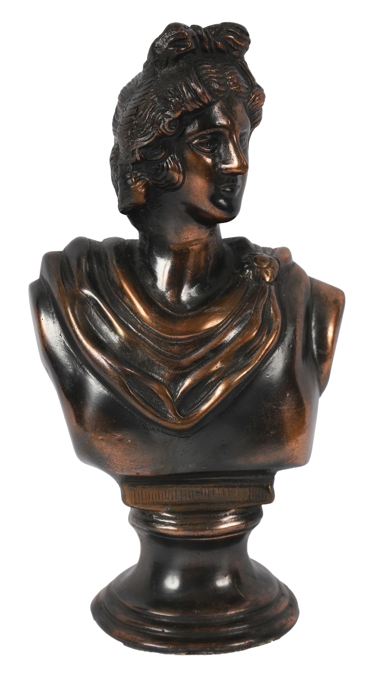 BRONZED BUST OF APOLLO: Bronzed bust of a classical male figure, shown in draped attire, mounted on a circular socle base, after the antique. SCULPTURE