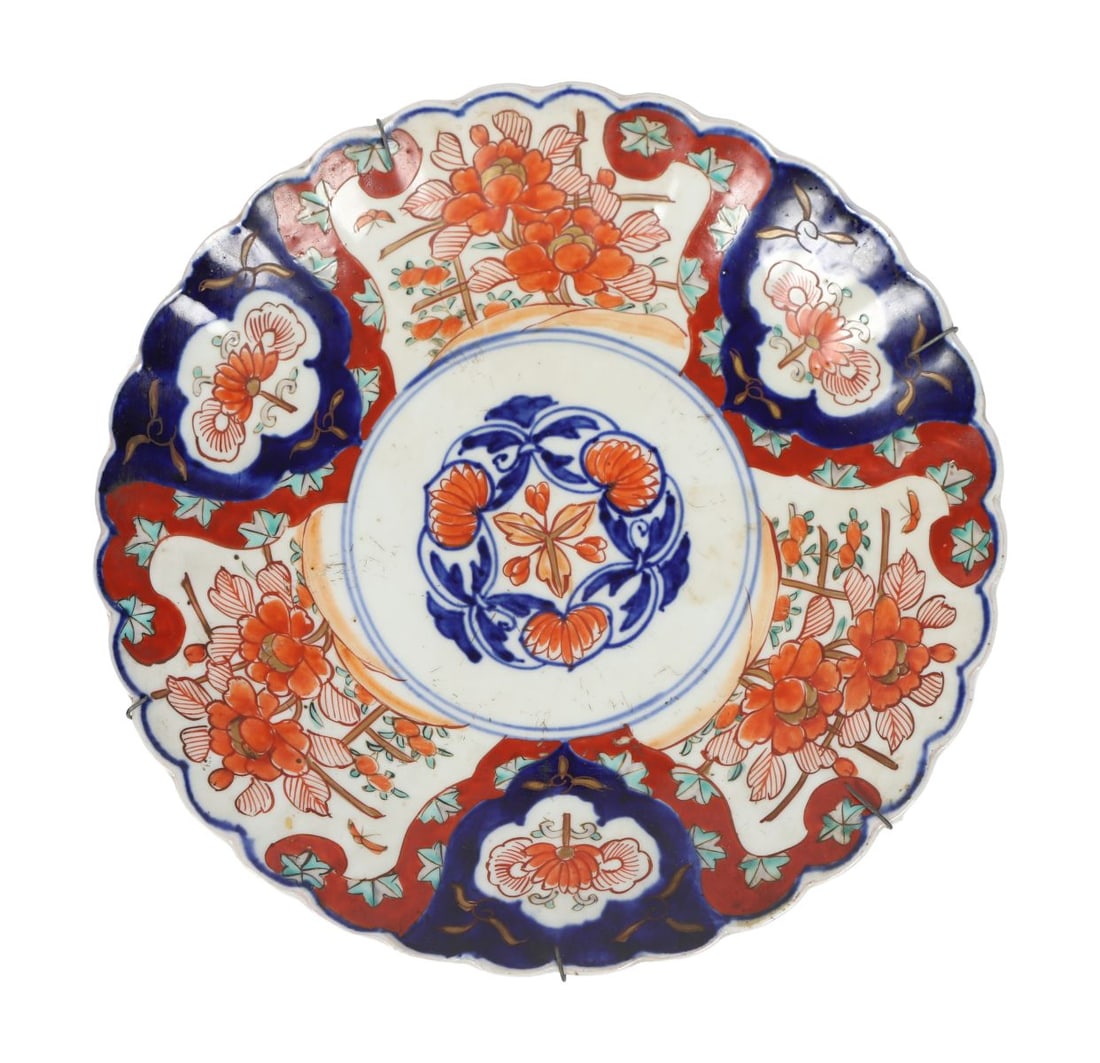 19TH-CENTURY JAPANESE CHARGER: A 19th-century Japanese charger decorated in Imari palette with radiating panels of birds, flowers and landscape motifs around a central medallion. JAPANESE