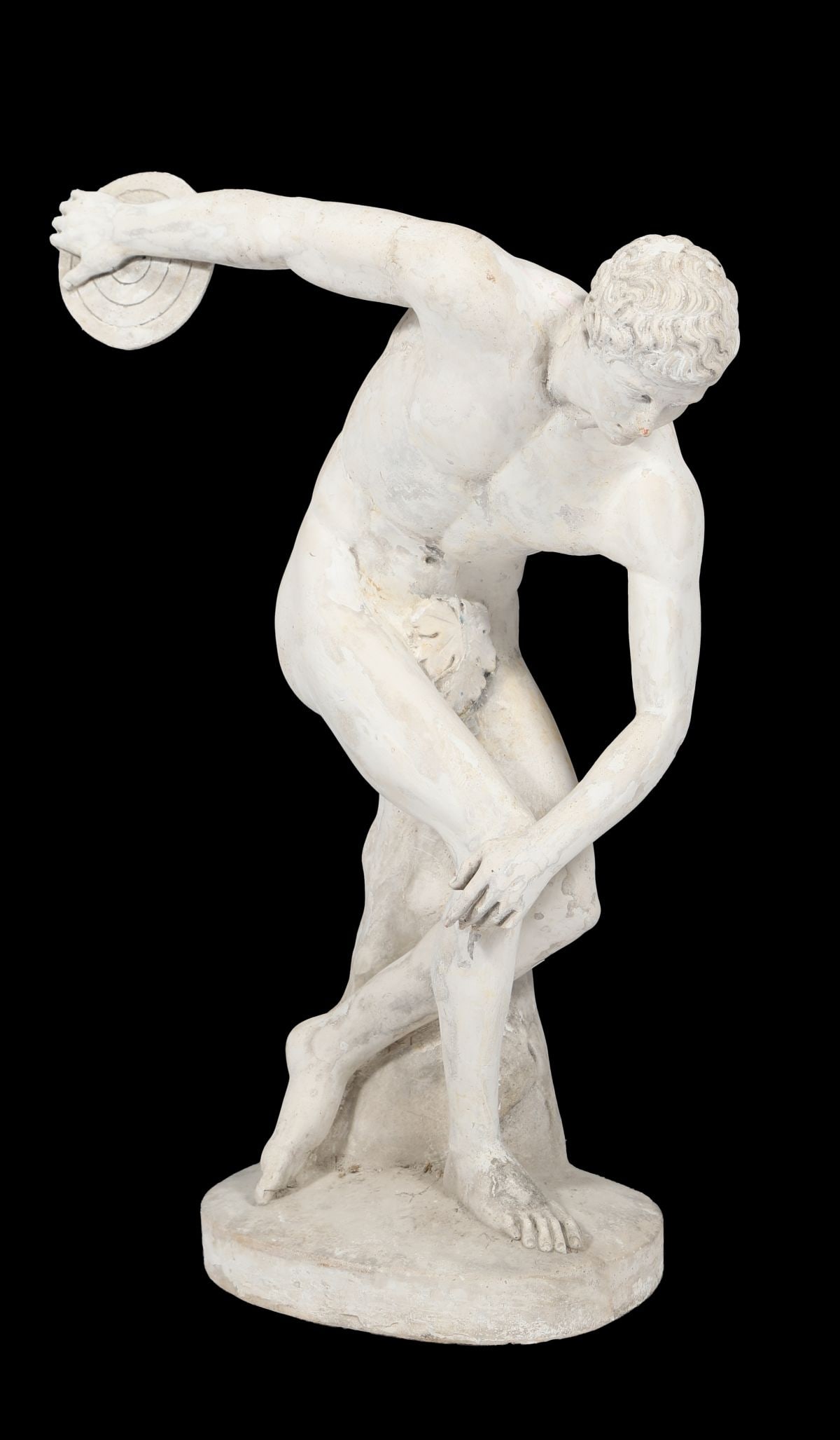 LATE 19TH-CENTURY FRENCH PLASTER SCULPTURE: OF A DISCUS THROWER, A late 19th-century French plaster figure of a discus thrower, modelled in the classical manner in a dynamic pose, raised on an integral base. SCULPTURE