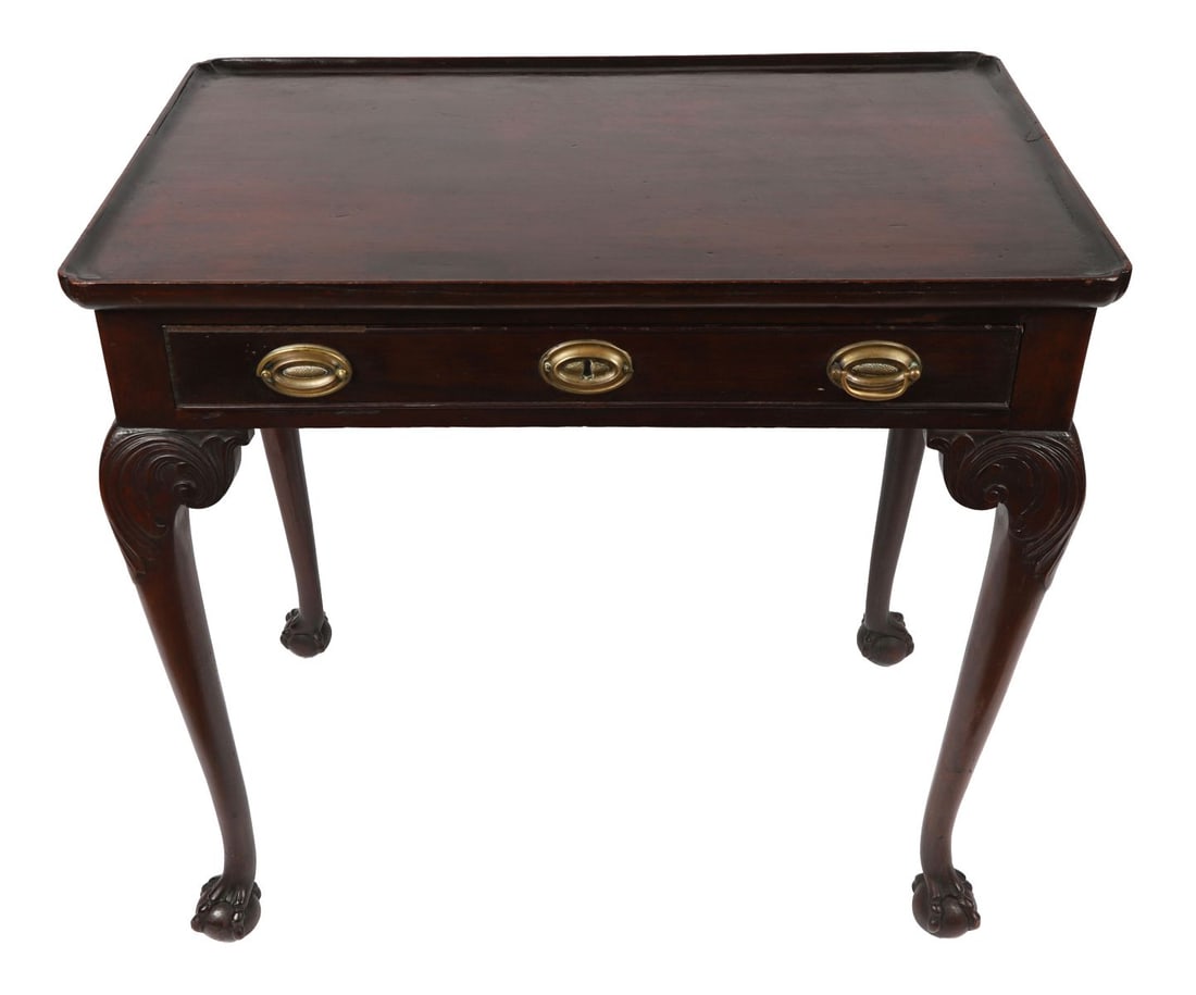 GEORGIAN MAHOGANY SILVER TABLE: Rectangular top above a frieze drawer, raised on carved supports and legs terminating in pad or scroll feet, of good colour and proportion. FURNITURE