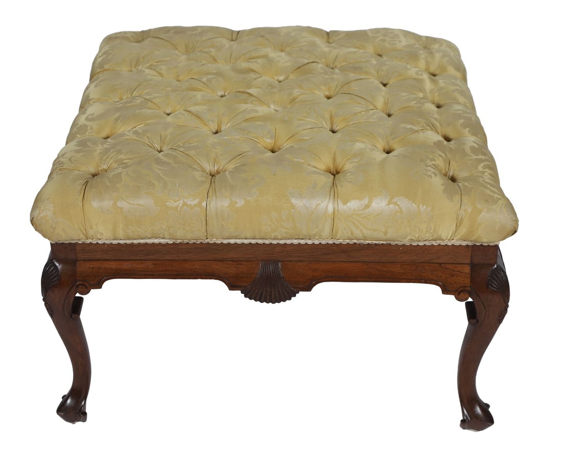 19TH-CENTURY MAHOGANY STOOL: The square upholstered seat above a shaped frieze centred by a carved shell, raised on cabriole legs terminating in pad feet. FURNITURE