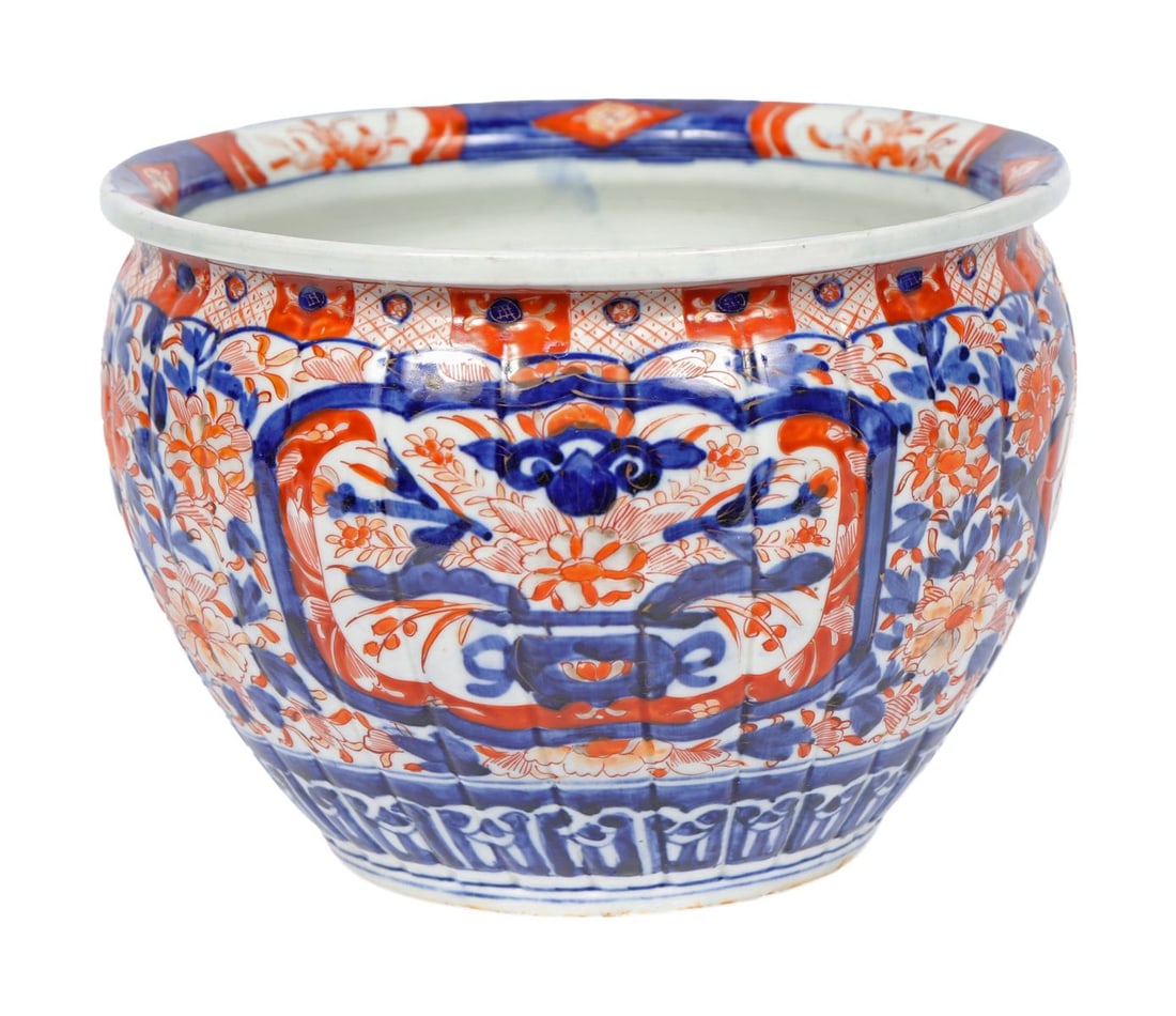 A 19TH CENTURY JAPANESE IMARI PHOENIX JARDINIERE: A 19th-century Japanese Imari jardinière of rounded form, decorated in iron-red, cobalt blue and gilt with phoenix and stylised floral panels, the rim with geometric banding. JAPANESE