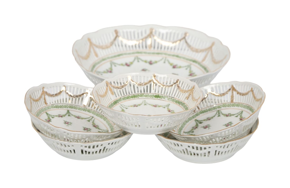 A SET OF FIVE ENGLISH DESSERT BOWLS: Accompanied by a matching fruit bowl, all of floral and ribbon design CERAMICS