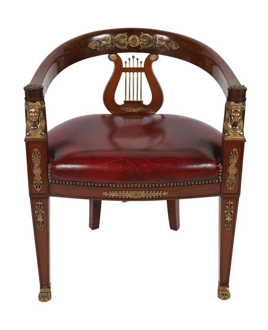 19TH-CENTURY FRENCH EMPIRE MAHOGANY DESK CHAIR: ORMOLU-MOUNTED, The curved back with lyre splat, applied with gilt-metal mounts, above a red leather seat, raised on tapering legs with further ormolu mounts. FURNITURE