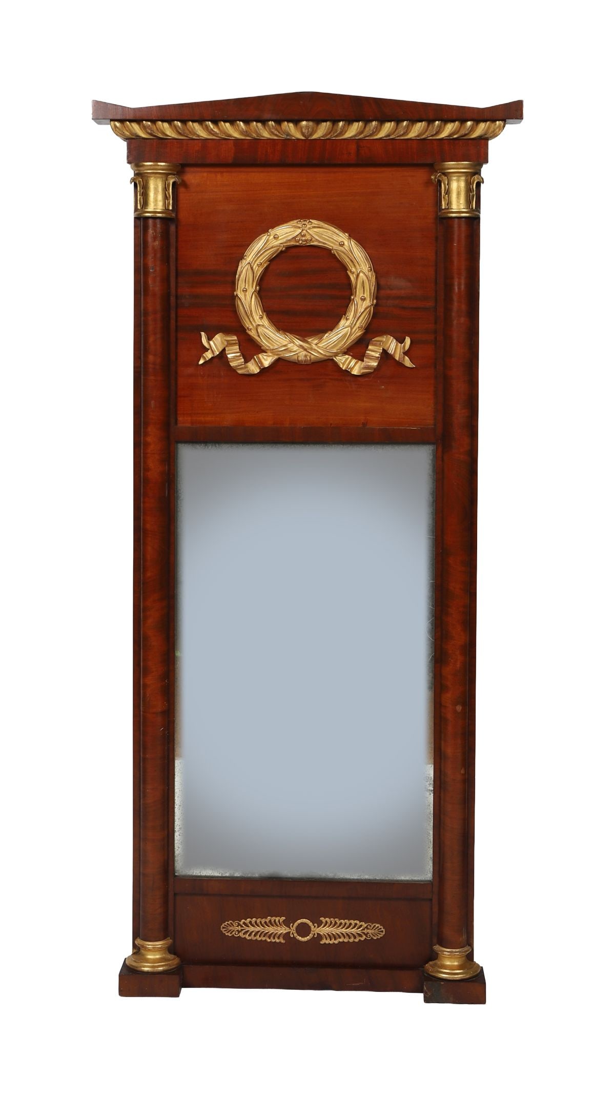 MAHOGANY AND PARCEL-GILT PIER MIRROR: FRENCH EMPIRE PERIOD, The rectangular plate within a moulded frame flanked by columns with gilt capitals, the frieze centred by a gilt laurel wreath, beneath a projecting cornice, the whole of restrai