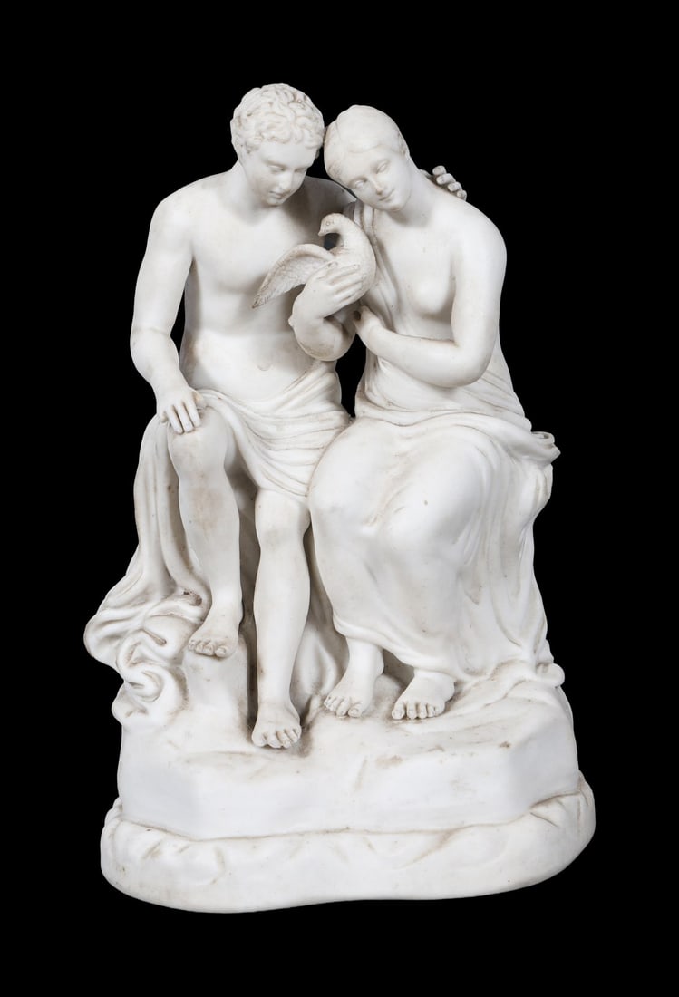 19TH-CENTURY PARIAN GROUP OF SEATED FIGURES: WITH DOVE. A 19th-century Parian porcelain group of a seated male and female figure, tenderly holding a dove between them, on a shaped base. PORCELAIN