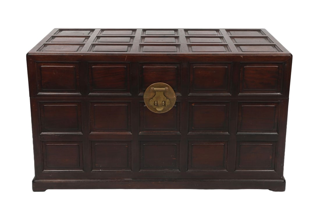 CHINESE PANELLED HARDWOOD TRUNK: the multi-panelled rectangular-shaped top opening to a lined interior above a similarly panelled body, raised on bracket feet. FURNITURE