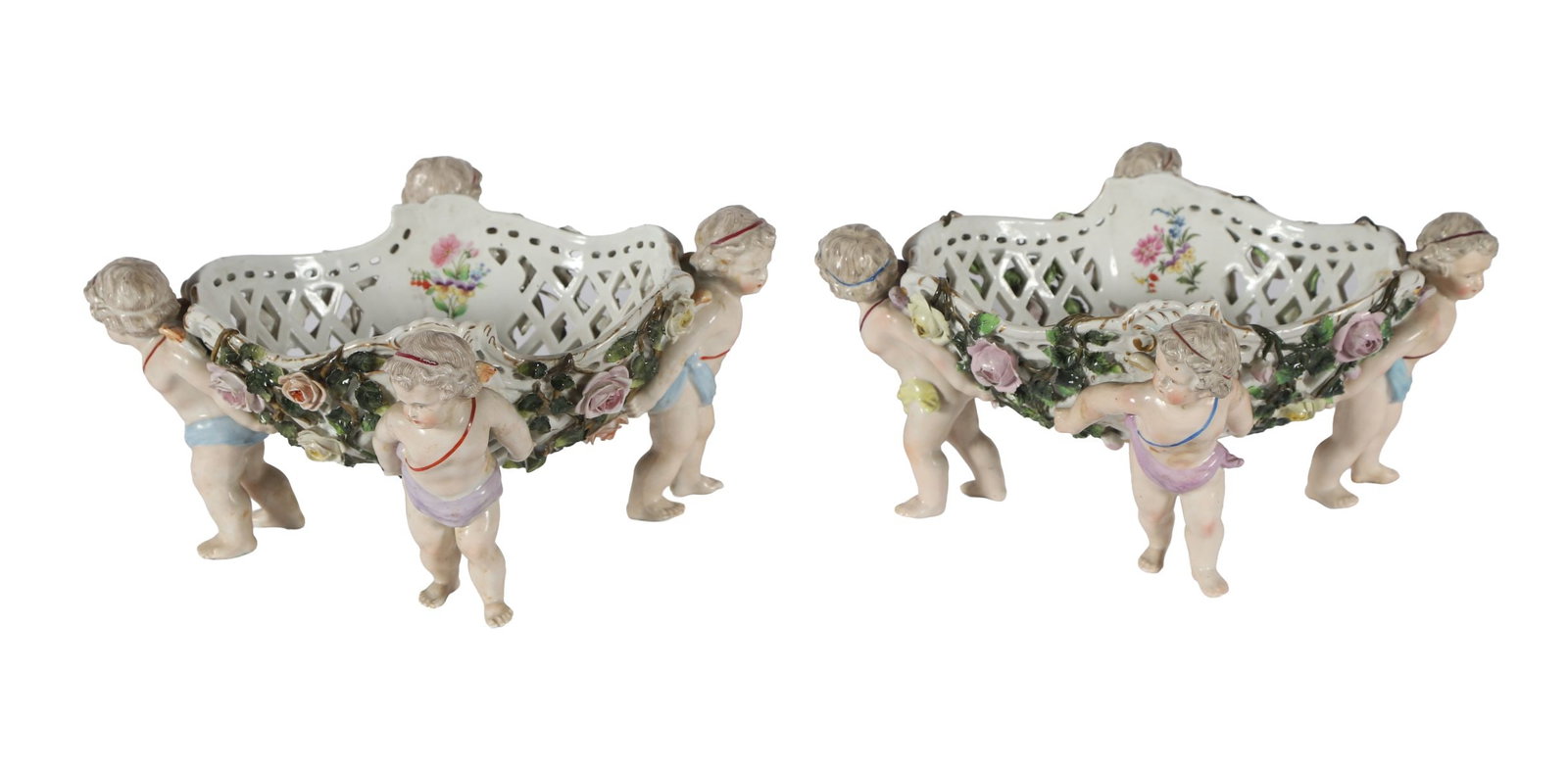 PR. 19TH CENTURY SITZENDORF RETICULATED BOWLS: A pair of 19th-century Sitzendorf porcelain bowls with pierced lattice sides, each supported by cherub figures and decorated with applied flowers. PORCELAIN