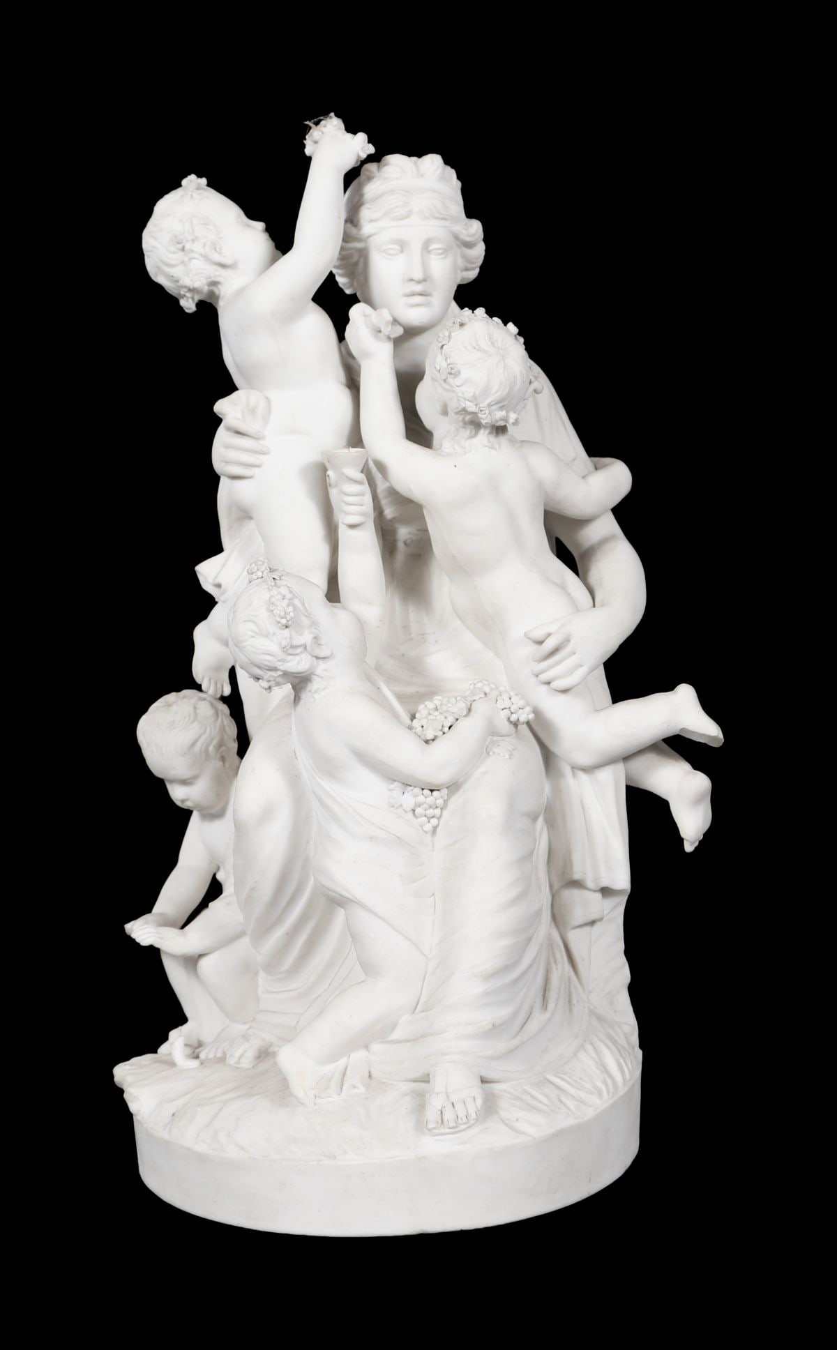 19TH-CENTURY PARIAN GROUP OF NYMPH AND CHERUBS: A 19th-century Parian porcelain group of a seated nymph attended by cherubs, the figures arranged in a naturalistic composition on a shaped base. PORCELAIN