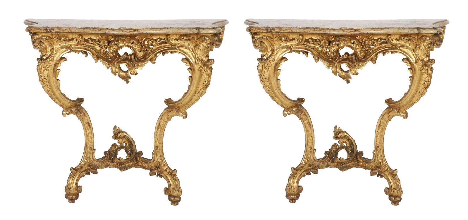 PR FRENCH ROCOCO STYLE GILTWOOD CONSOLE TABLES: A pair of 19th-century French giltwood console tables of serpentine outline, each with variegated marble top above richly carved aprons with scrolling acanthus and shell ornament, raised on cabriole s