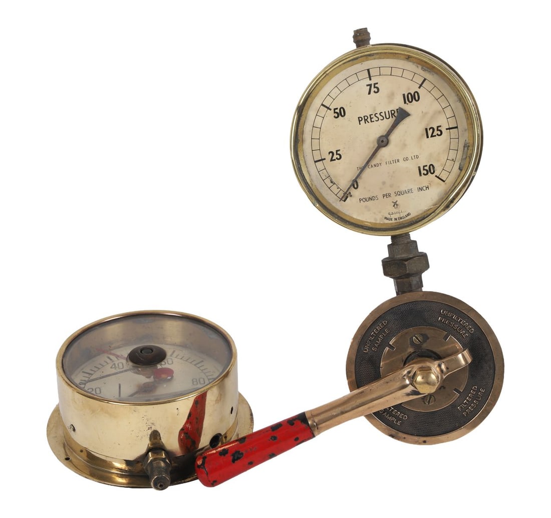 PAIR OF BRASS INDUSTRIAL PRESSURE GAUGES: Pair of brass-cased pressure gauges, each with glazed dial and calibrated markings in pounds per square inch, one bearing the maker’s mark The Candy Filter Co. Ltd., the other of similar form, toget